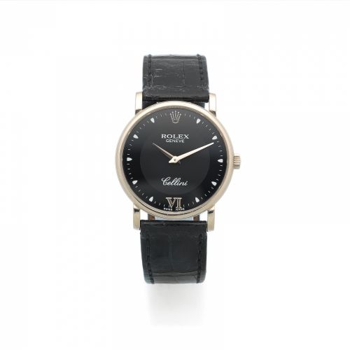 Rolex. A mid-size 18K white gold manual wind wristwatch