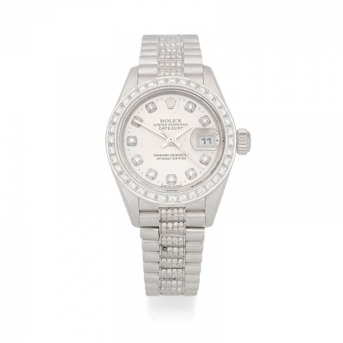 Rolex. A lady's 18K white gold and diamond set automatic calendar bracelet watch
