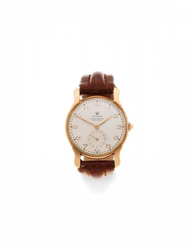 Rolex. An 18K gold manual wind wristwatch