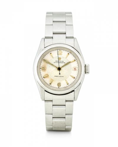 Rolex. A stainless steel manual wind wristwatch with red date