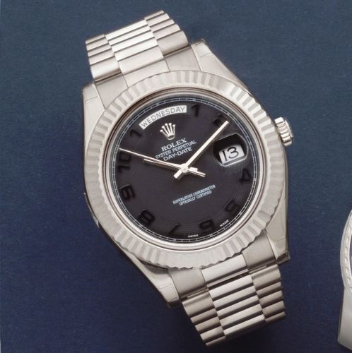 Rolex. An 18K white gold automatic calendar bracelet watch