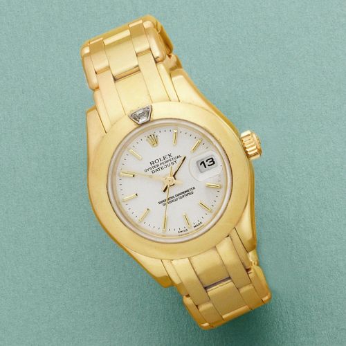 Rolex. A lady's 18K gold automatic calendar bracelet watch