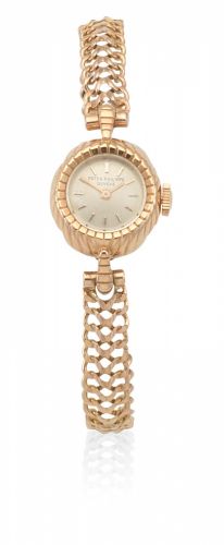 Patek Philippe. A lady's gold manual wind bracelet watch