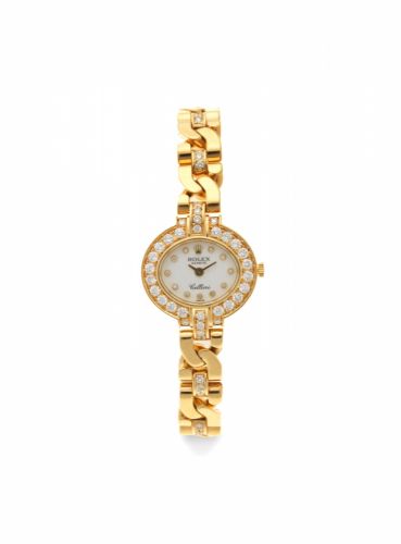 Rolex. A lady's 18K gold and diamond set manual wind bracelet watch