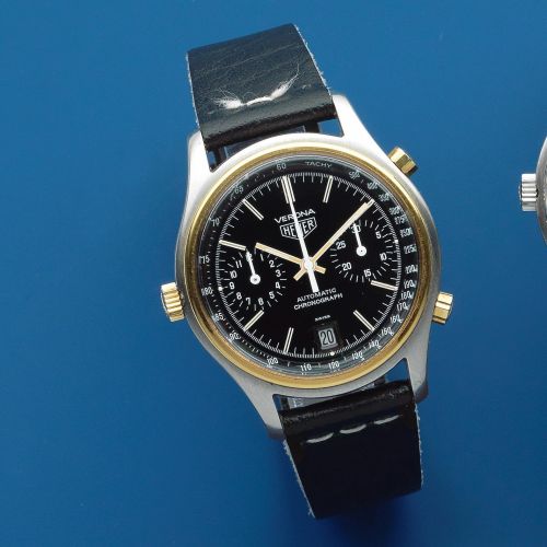 Heuer. A stainless steel and gold plated automatic calendar chronograph wristwatch