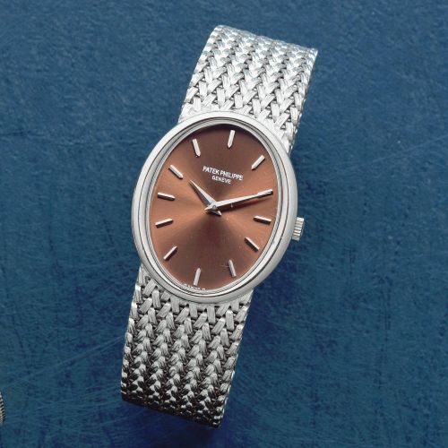 Patek Philippe. A lady's 18K white gold manual wind bracelet watch