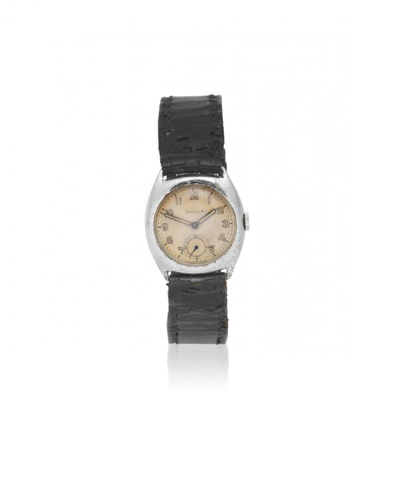 Rolex. A mid-size stainless steel manual wind tonneau form wristwatch
