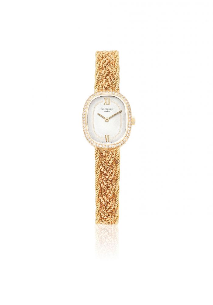 Patek Philippe. A lady's 18K gold and diamond set manual wind bracelet watch
