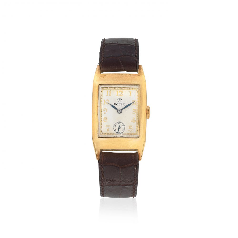 Rolex. A 9K gold manual wind rectangular wristwatch