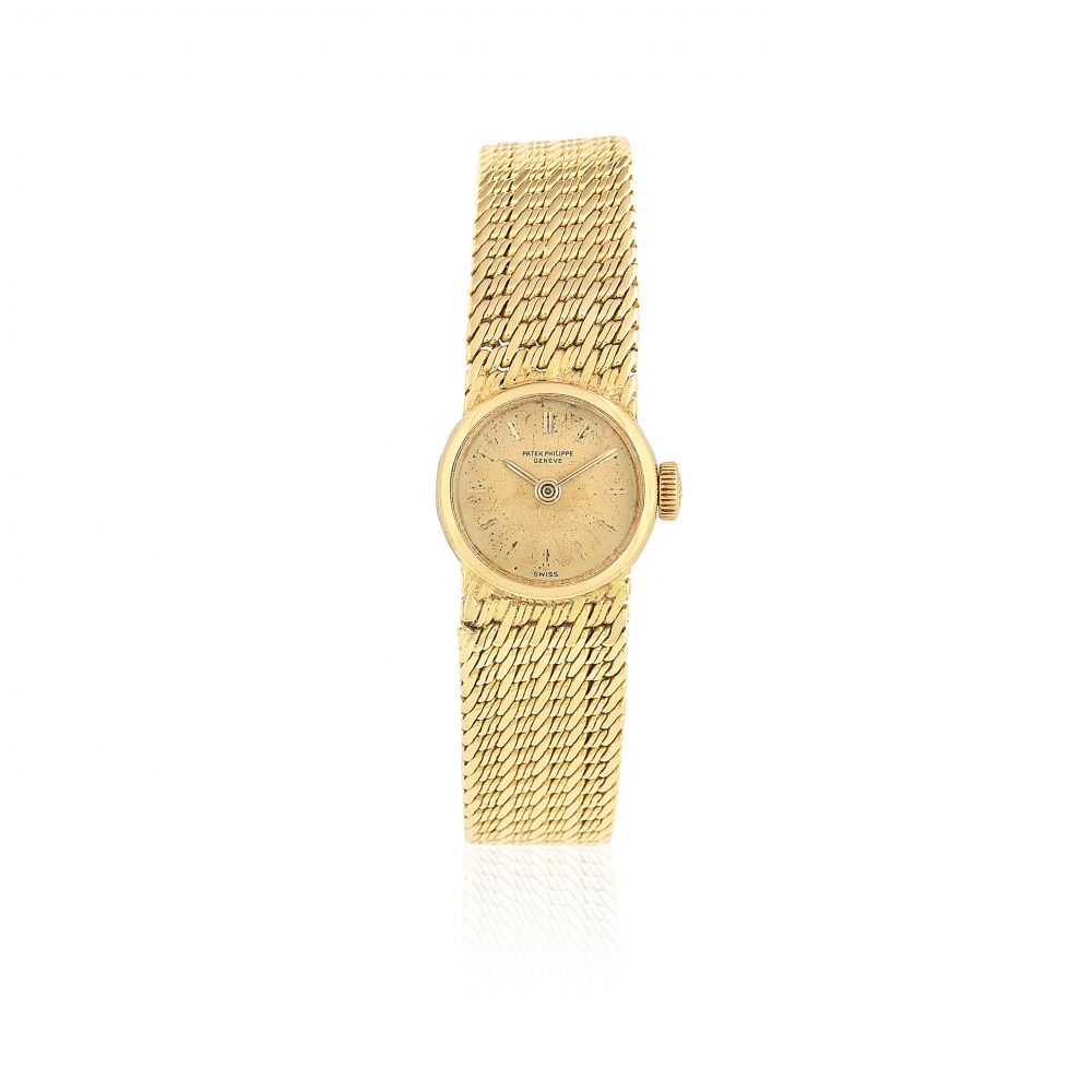 Patek Philippe. A lady's 18K gold manual wind bracelet watch