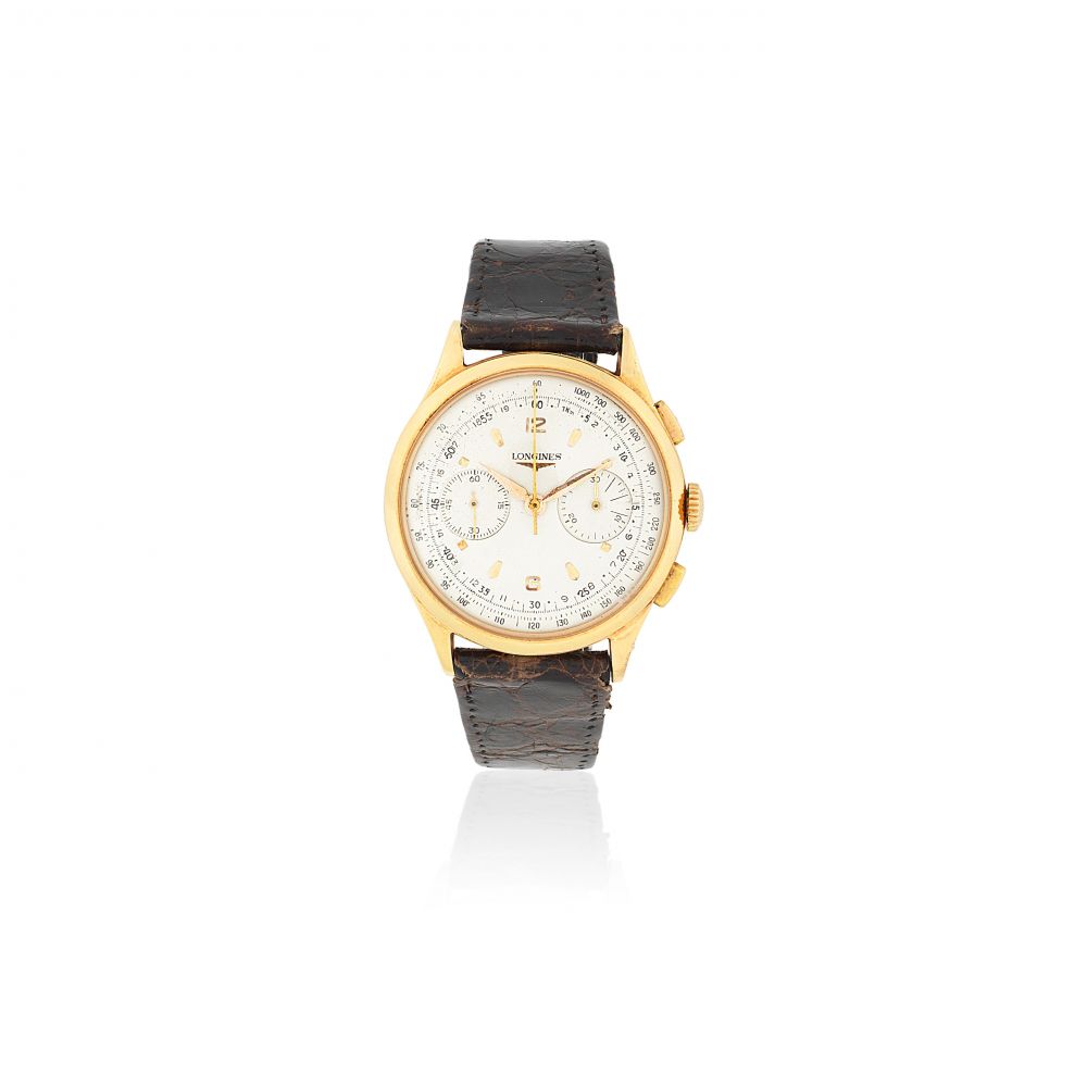 Longines. An 18K gold manual wind chronograph wristwatch
