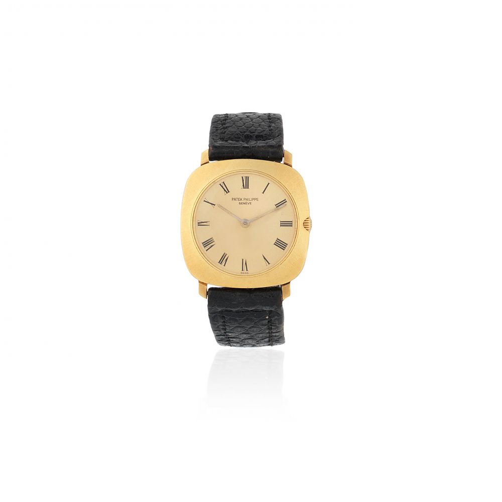 Patek Philippe. An 18K gold manual wind cushion form wristwatch