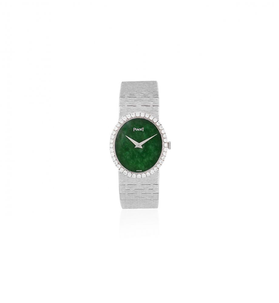 Piaget. A lady's 18K white gold and diamond set oval bracelet watch with green hardstone dial