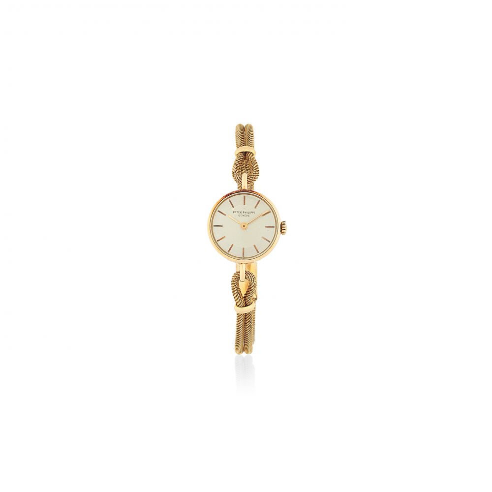 Patek Philippe. A lady's 18K gold manual wind bracelet watch