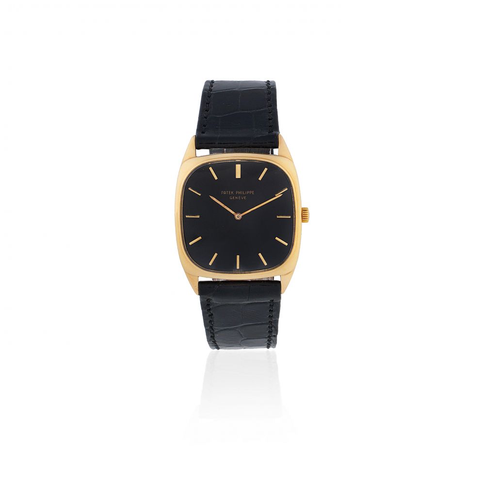 Patek Philippe. An 18K gold manual wind cushion form wristwatch
