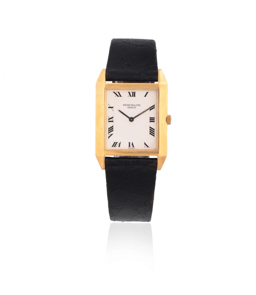 Patek Philippe. An 18K gold manual wind rectangular wristwatch