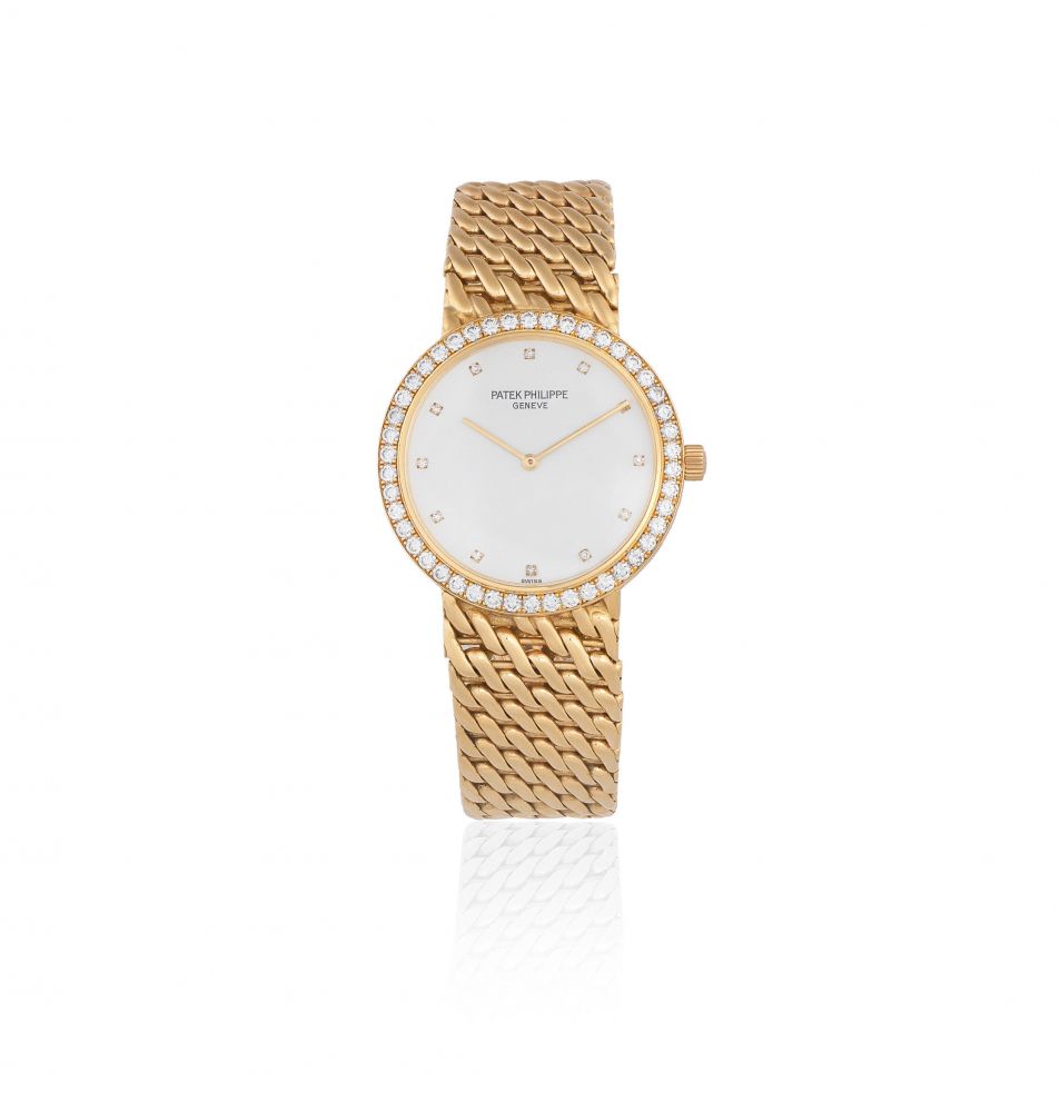 Patek Philippe. A lady's 18K gold and diamond set manual wind bracelet watch