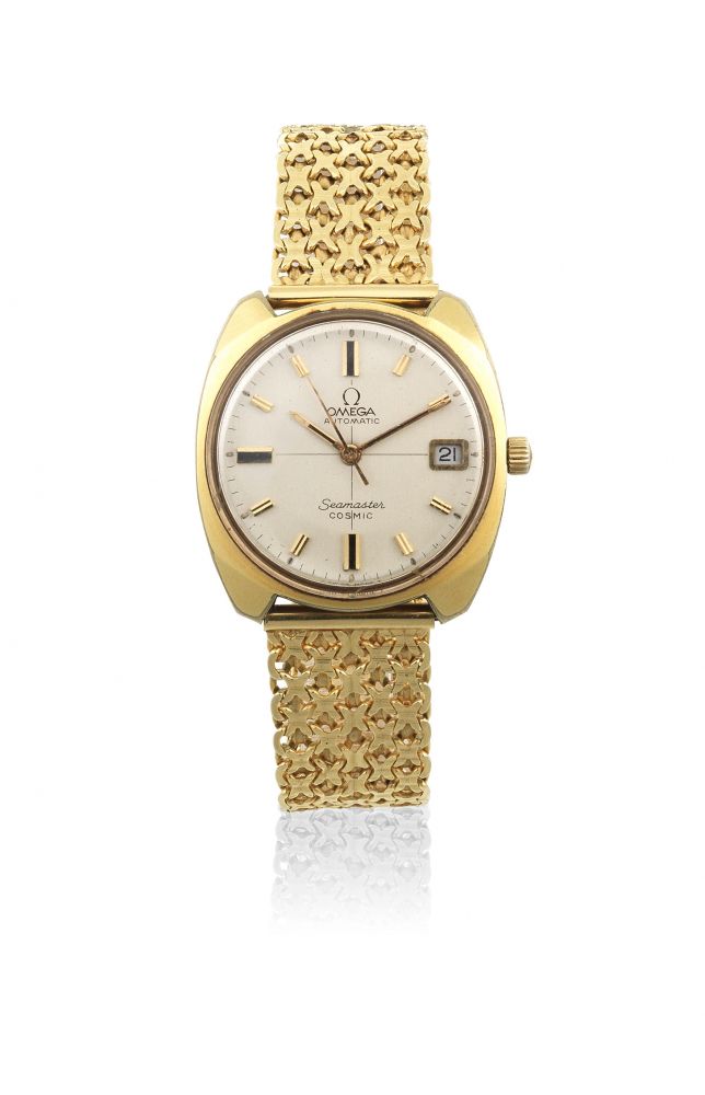 Omega. A gold plated automatic calendar watch with 18K gold bracelet