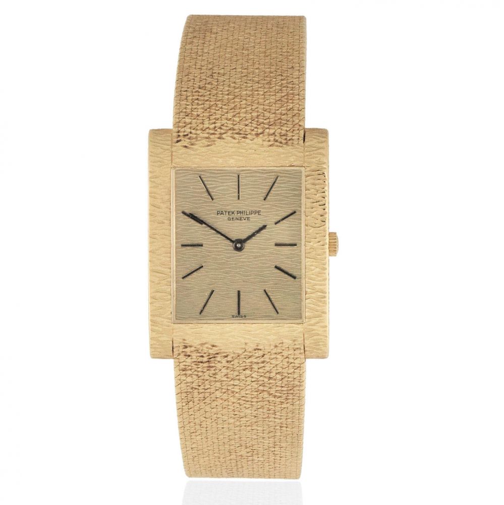 Patek Philippe. An 18K gold manual wind rectangular bracelet watch