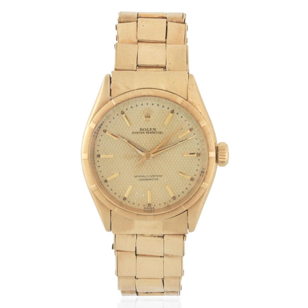 Rolex. An 18K gold automatic bracelet watch