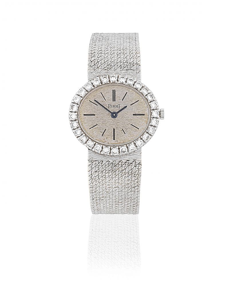 Piaget. A lady's 18K white gold and diamond set manual wind bracelet watch