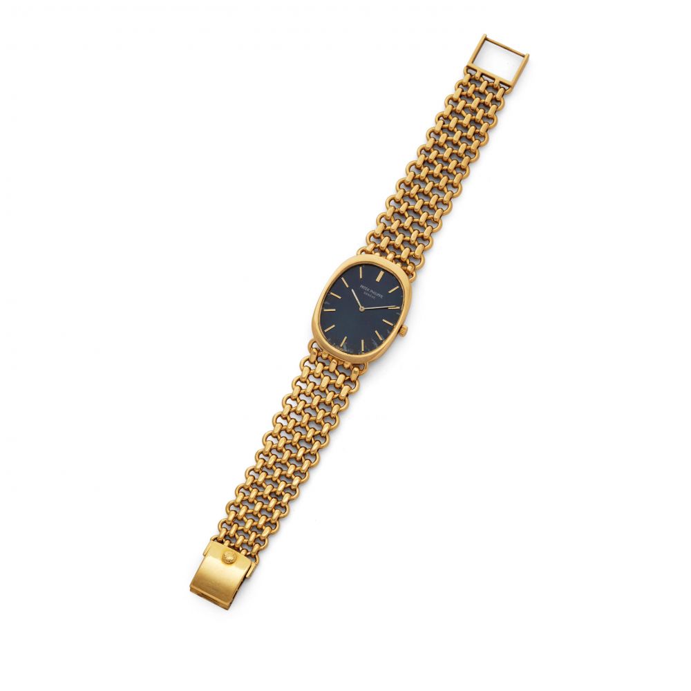 PATEK PHILIPPE. AN 18K YELLOW GOLD MANUAL WIND BRACELET WATCH