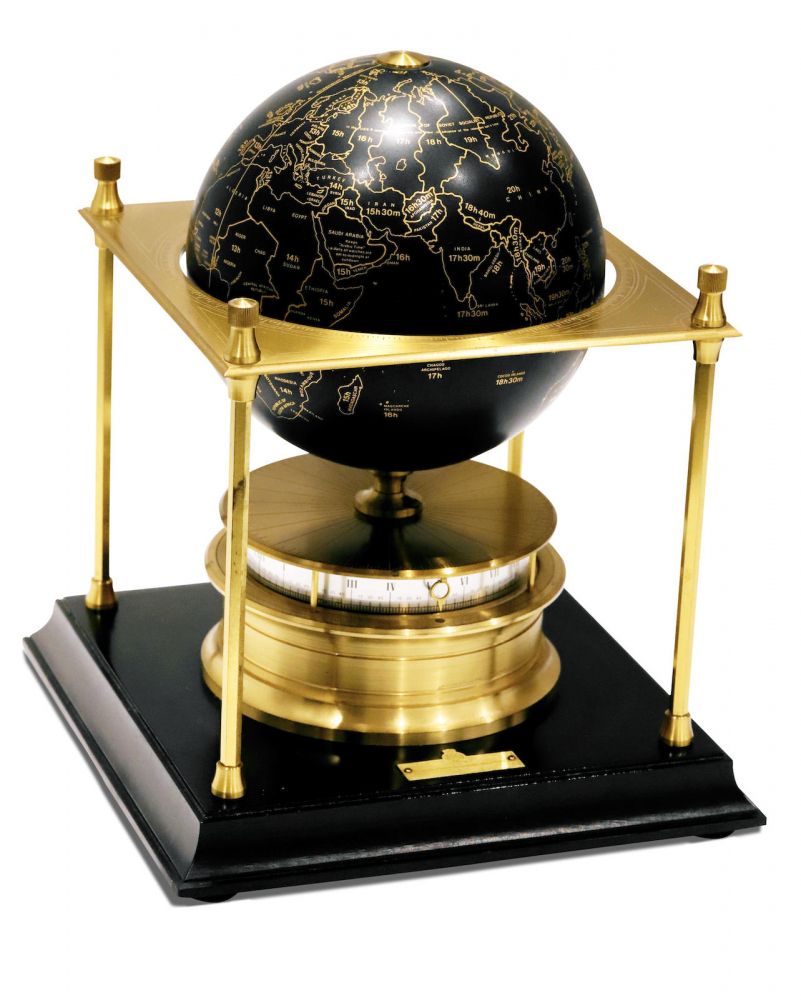 IMHOF | SWISS ROYAL GEOGRAPHICAL SOCIETY, A RARE BRASS WORLD Globe CLOCK, CIRCA 1979
