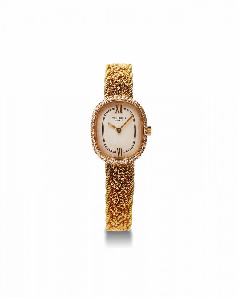 Patek Philippe | Ref.4498/2, A Lady's Yellow Gold and Diamond-Set Bracelet Watch, 1981