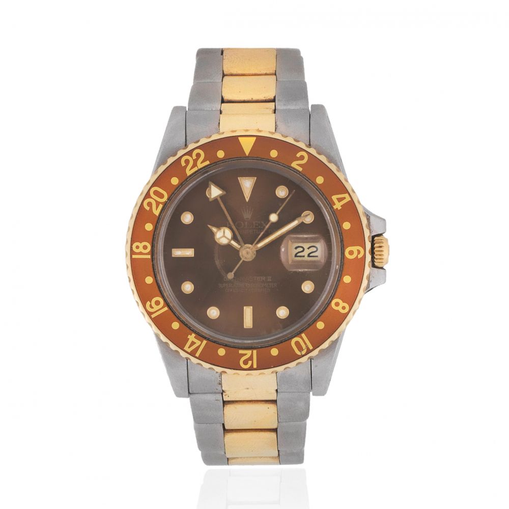 Rolex. A stainless steel and gold automatic calendar bracelet watch with dual time zone