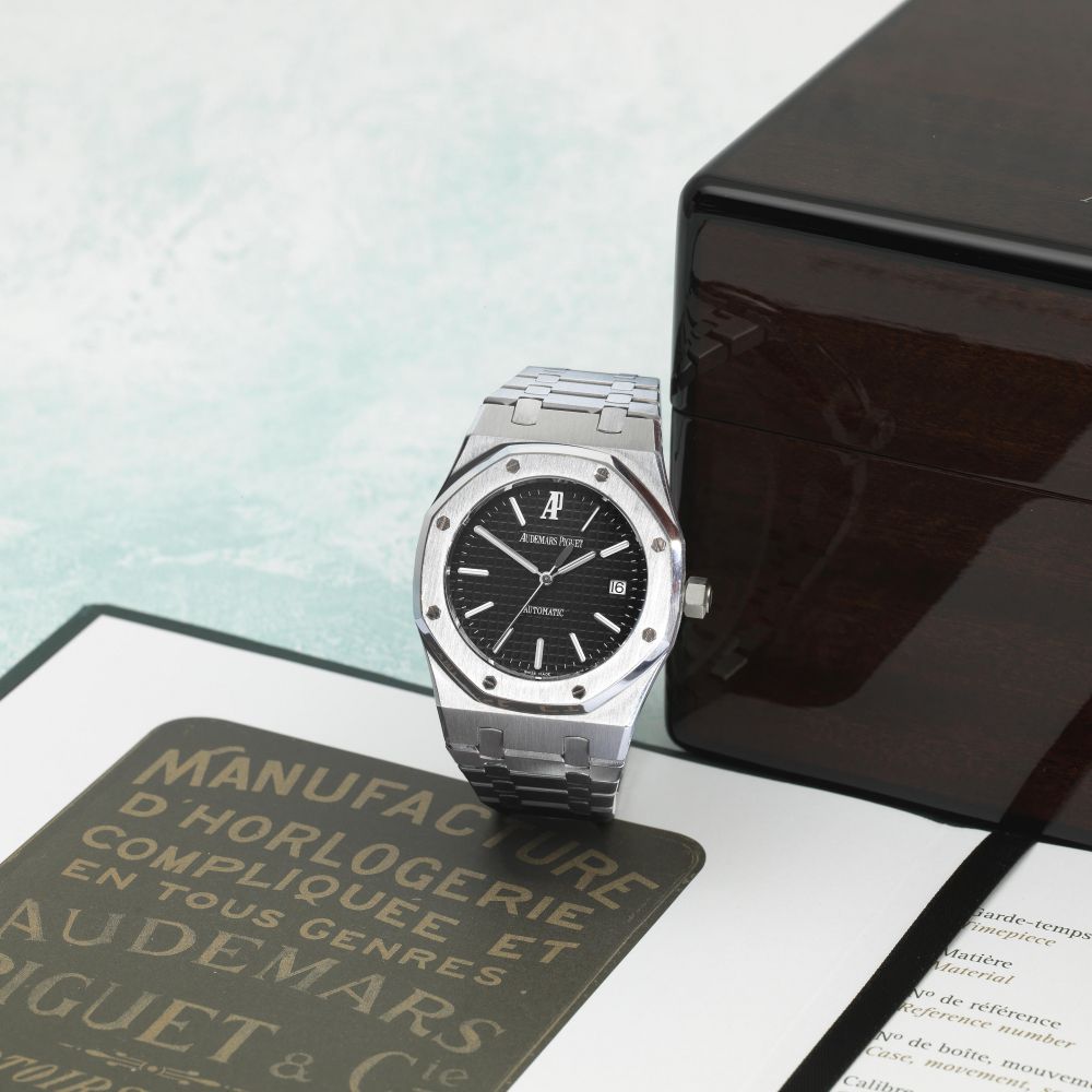 Audemars Piguet. A stainless steel automatic calendar bracelet watch