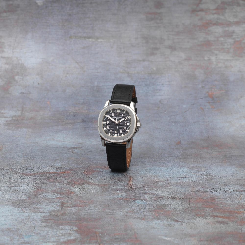 Patek Philippe. A stainless steel automatic calendar wristwatch