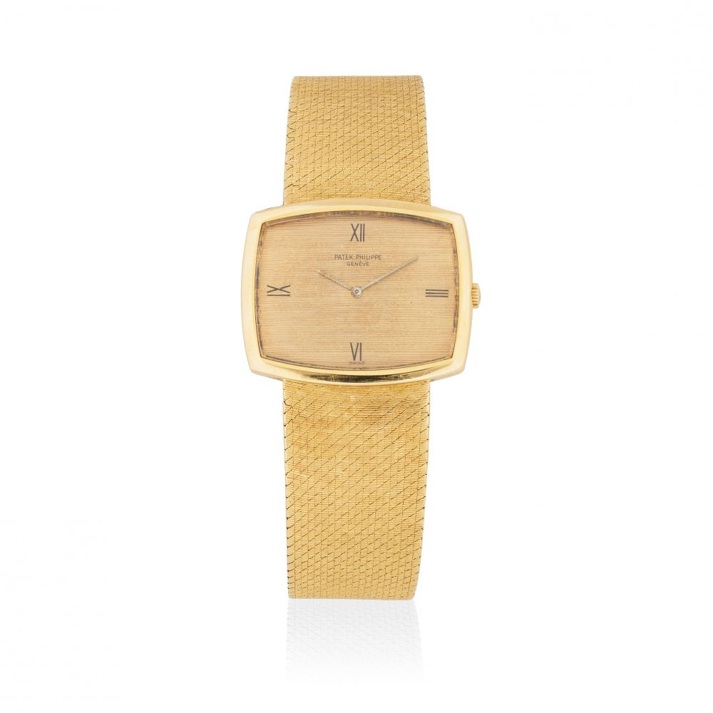 Patek Philippe. An 18K gold manual wind cushion form bracelet watch