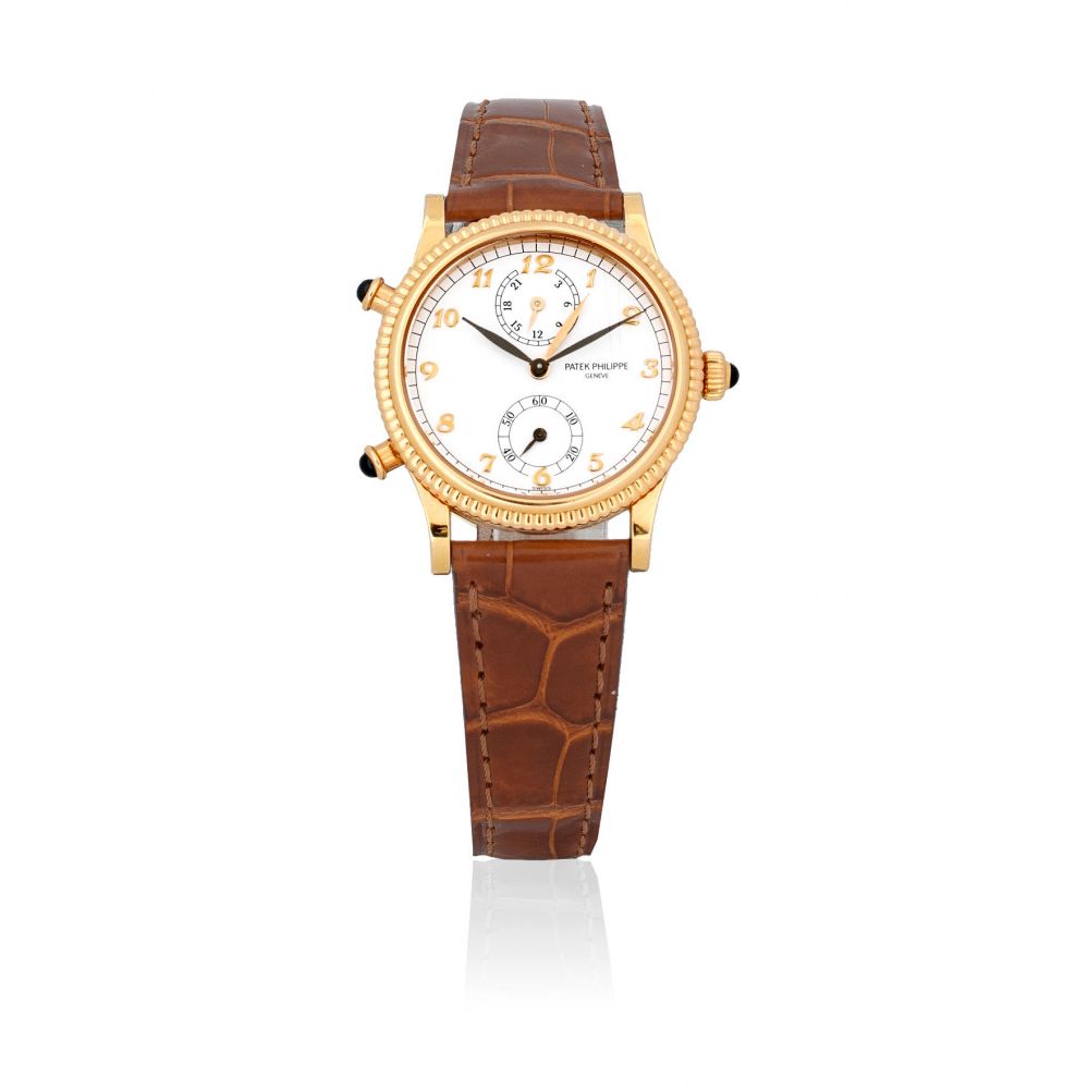 Patek Philippe. A lady's fine 18K gold manual wind wristwatch with dual time zone