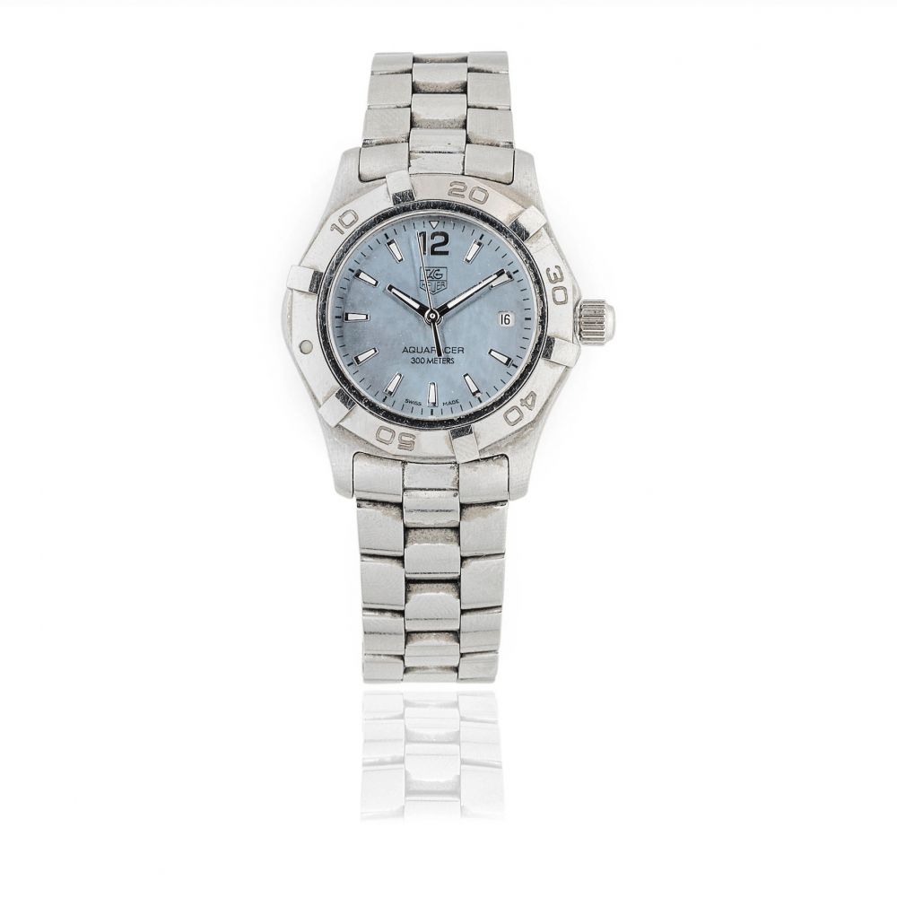 Tag Heuer. A lady's stainless steel quartz calendar bracelet watch
