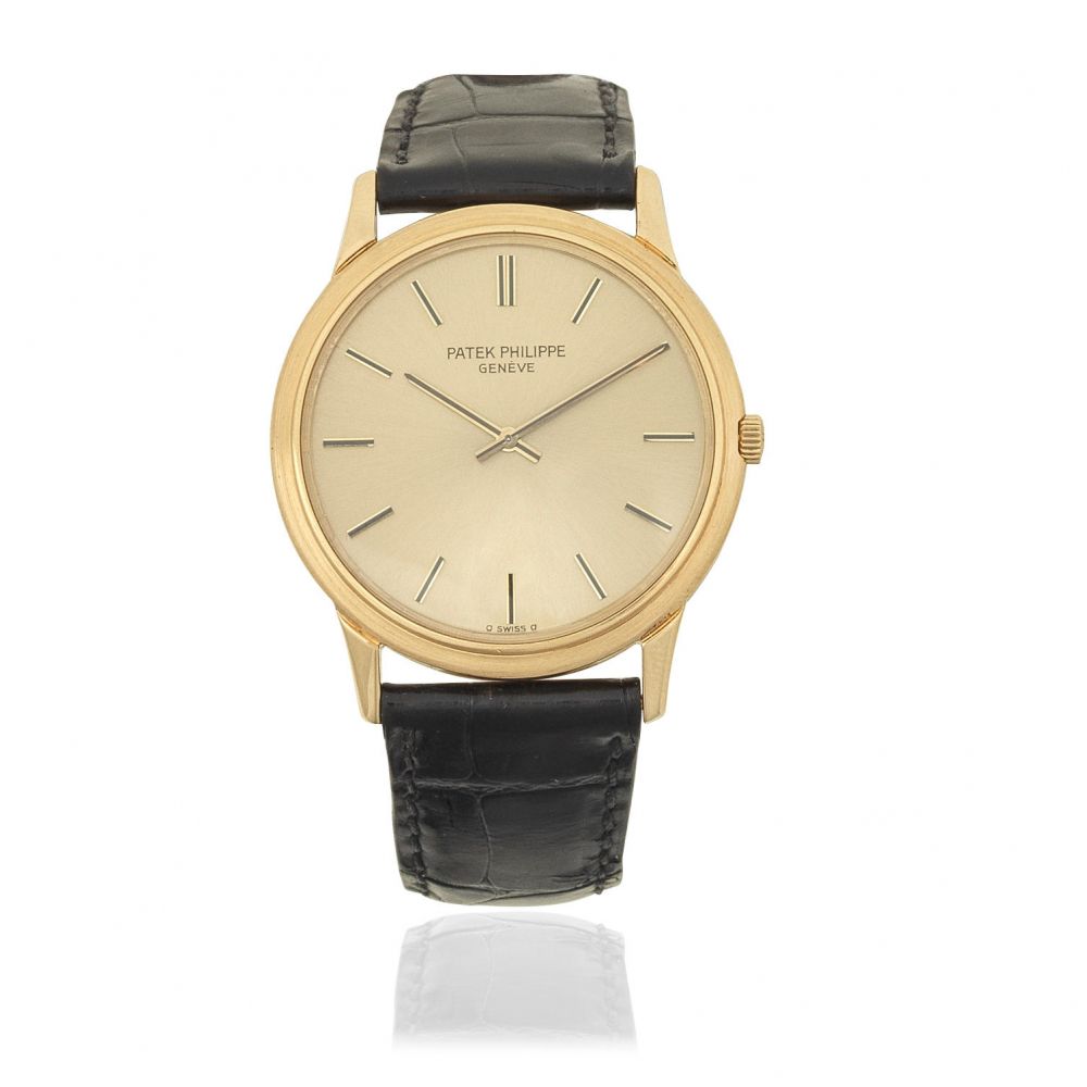 Patek Philippe. An 18K gold automatic wristwatch with sigma dial