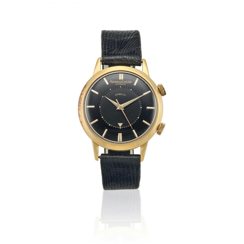 JAEGER LECOULTRE. A GOLD FILLED AUTOMATIC WRISTWATCH WITH ALARM RETAILED BY GUBELIN