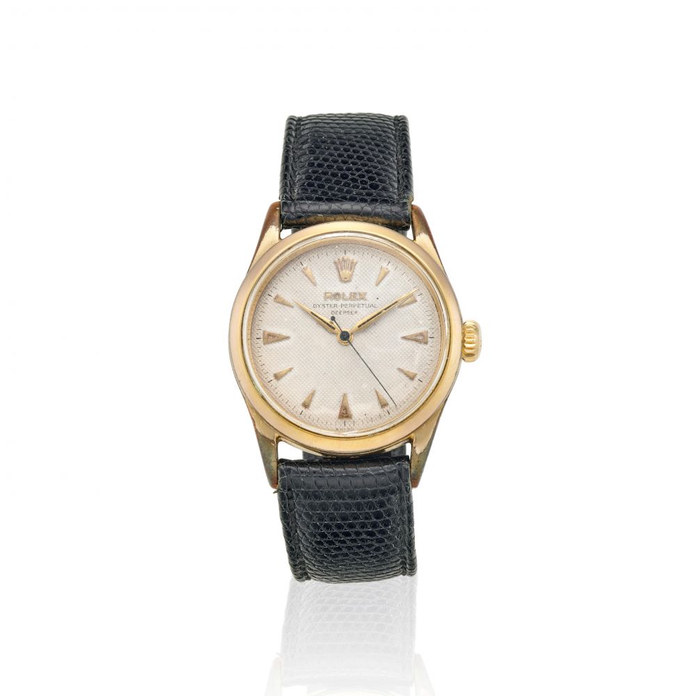 ROLEX. A GILT AUTOMATIC WRISTWATCH