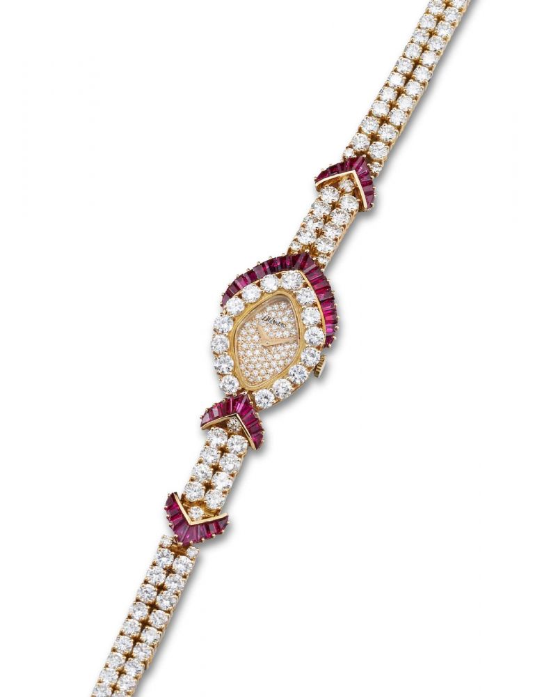 DeLaneau | A yellow gold, Ruby and Diamond-set Bracelet Watch, Circa 1991
