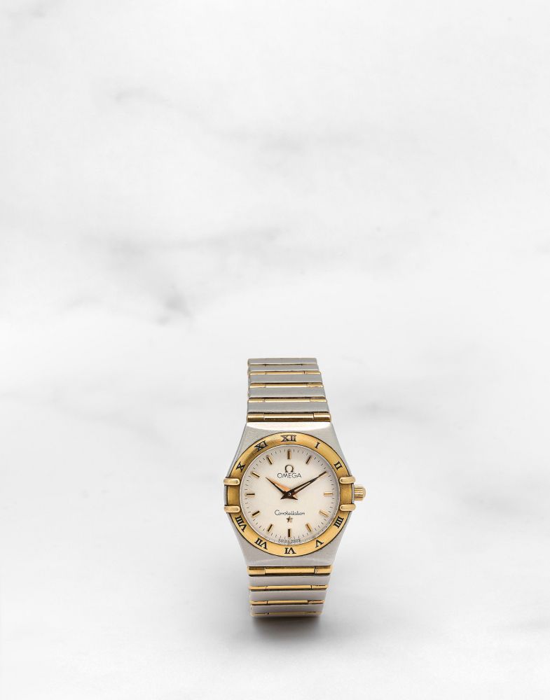 OMEGA. MONTRE BRACELET DE DAME EN OR 18K (750) ET ACIER MOUVEMENT QUARTZ