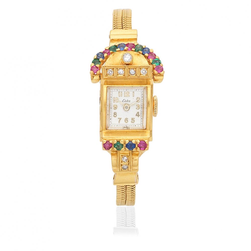 Eska. An unusual lady's 14k gold diamond and gem set manual wind cocktail bracelet watch