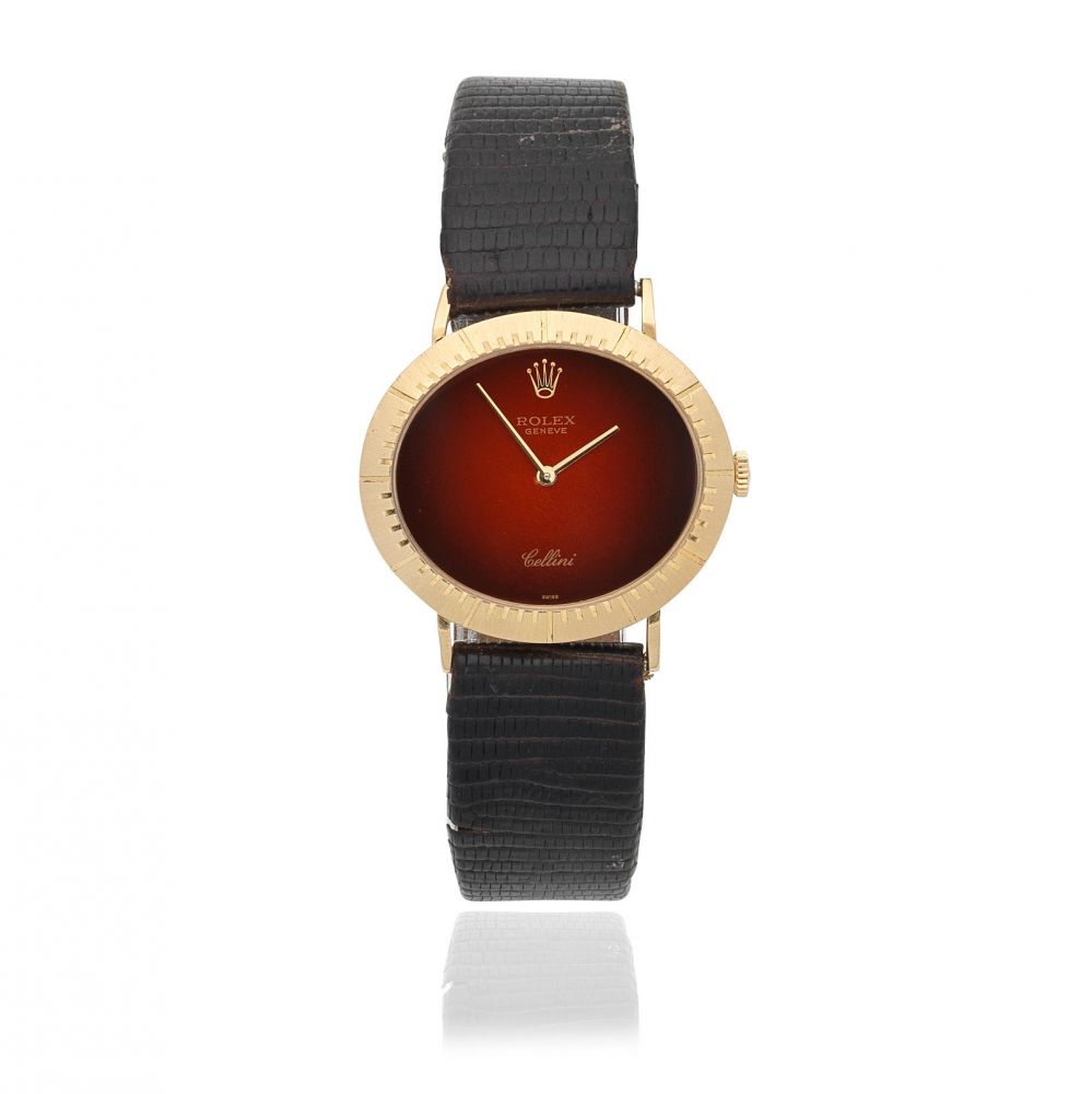 Rolex. A recently serviced 18K gold manual wind oval wristwatch