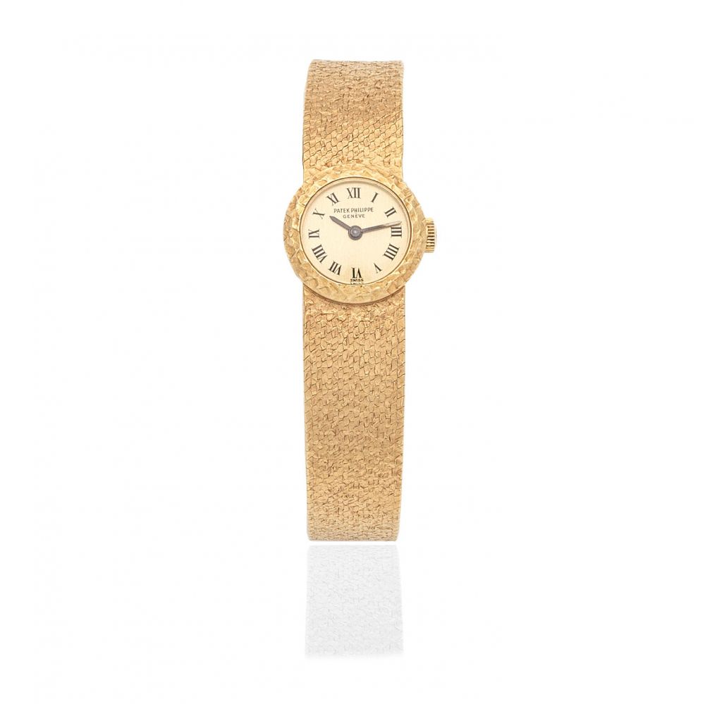 Patek Philippe. A lady's 18K gold manual wind bracelet watch