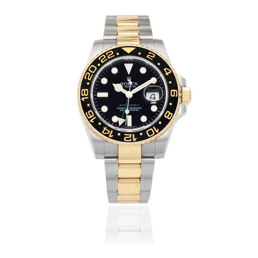 Rolex. A stainless steel and gold automatic calendar bracelet watch with dual time zone