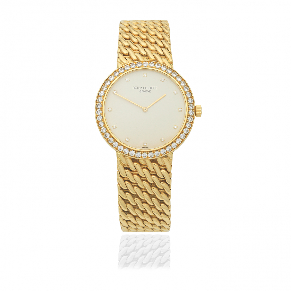 Patek Philippe. An 18K gold diamond set manual wind bracelet watch