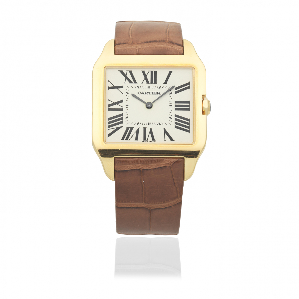 Cartier. An 18K gold manual wind rectangular wristwatch
