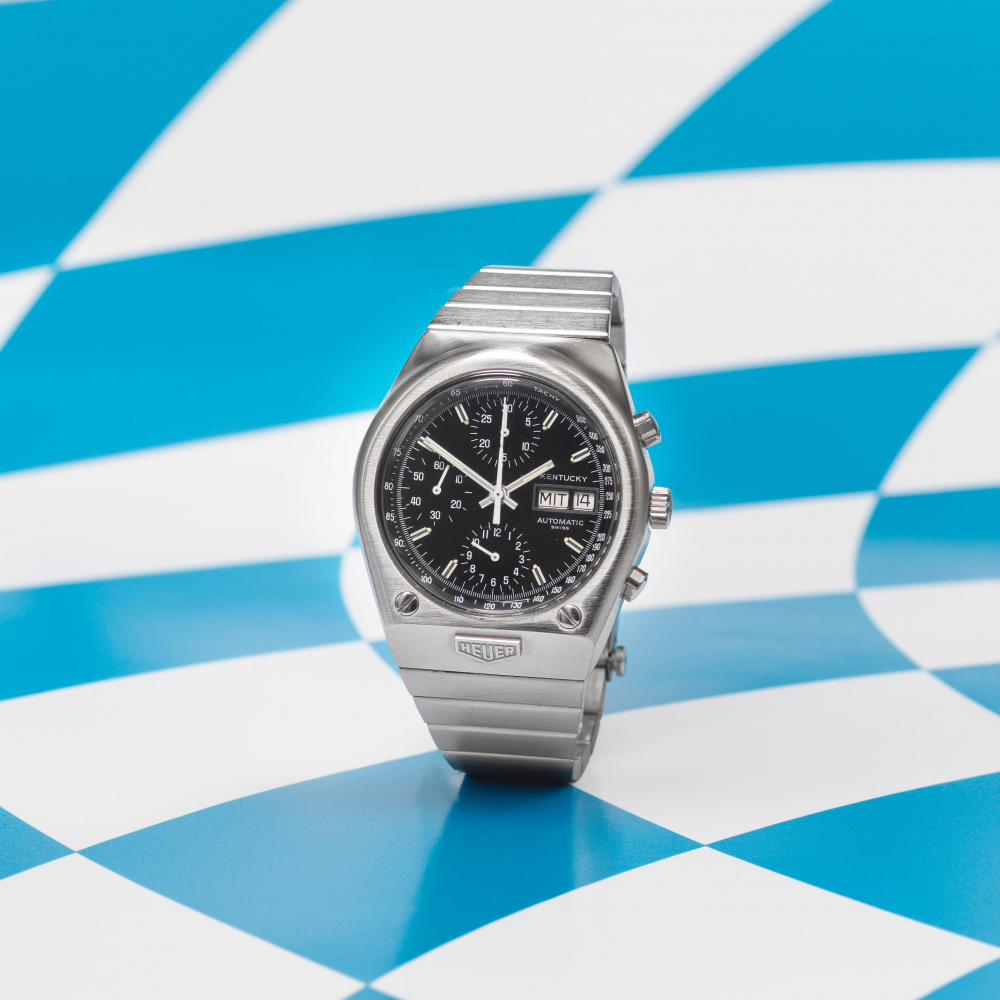 Heuer. A rare and unusual stainless steel automatic calendar chronograph bracelet watch