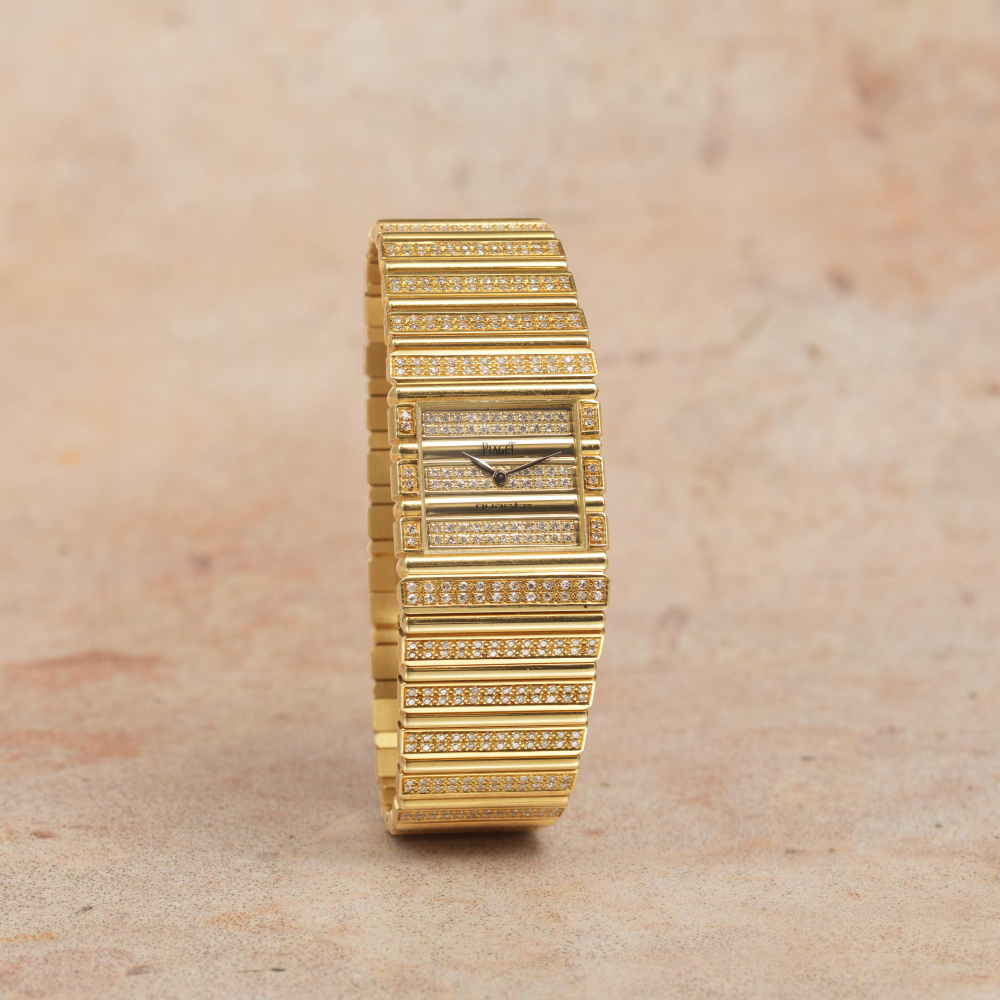Piaget. A fine 18K gold diamond set quartz bracelet watch