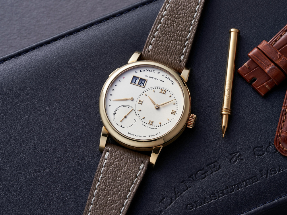 A. LANGE & SÖHNE | LANGE 1 DAYMATIC, REF.320.021, A FINE YELLOW GOLD WRISTWATCH WITH DATE AND RETROGRADE DAY, CIRCA 2021