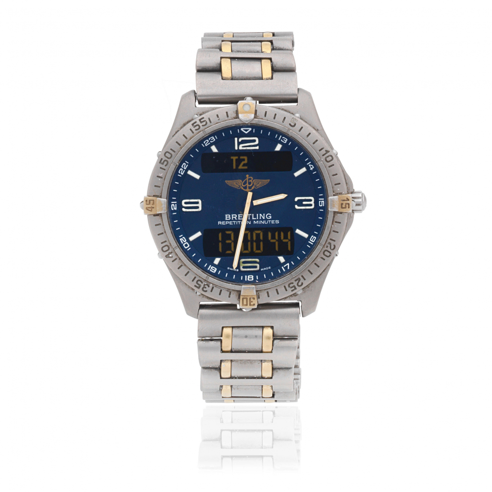 Breitling. A titanium and gilt quartz bracelet watch