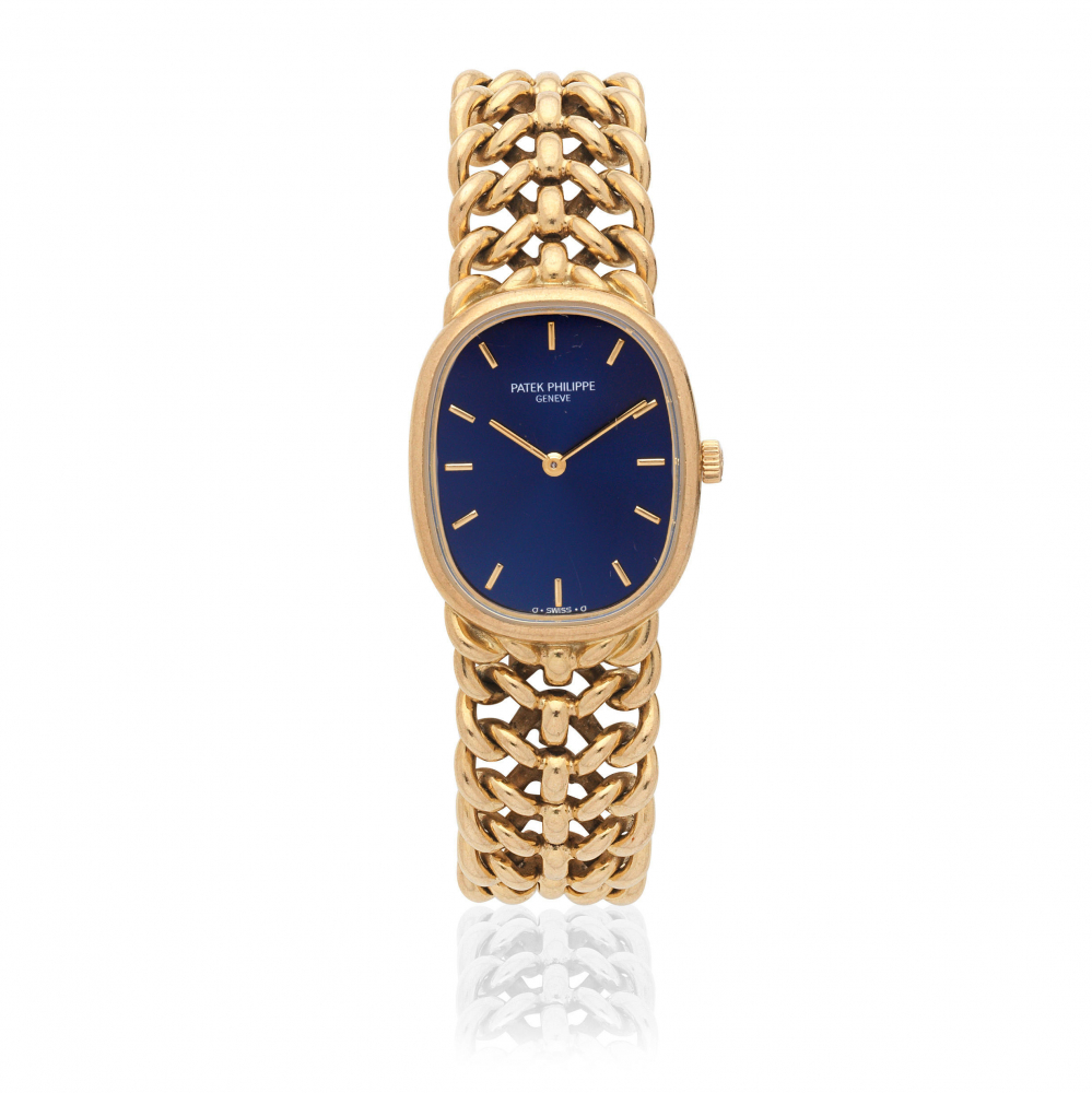 Patek Philippe. A lady's 18K gold manual wind bracelet watch with sigma dial